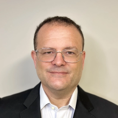 Dr. Sean Batte smiling in a suit.