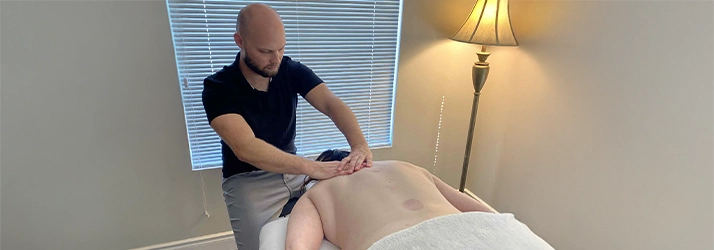 Chiropractic London ON Joel Massaging A Patient Massage Therapist Joel Massaging A Patient